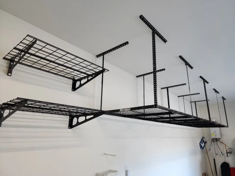 Ceiling-mounted overhead storage racks installed in a garage